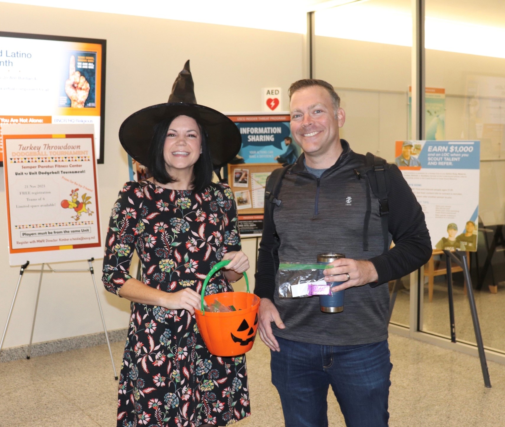 DHS Leader Development Program Manager Alyssa Lombardi handing out Halloween Leader Grams.